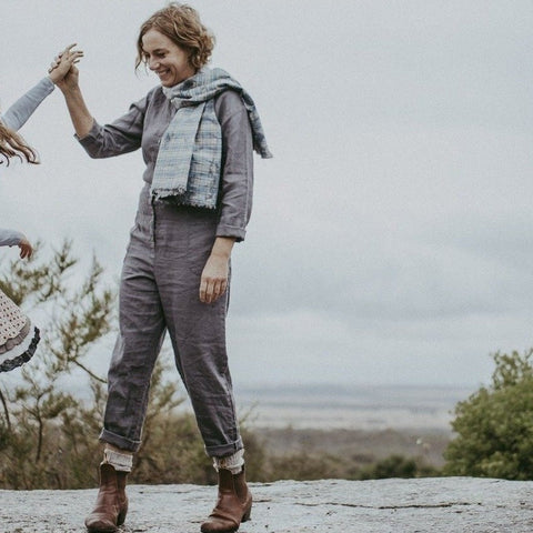 Linen overalls are a great fit, fitted but not tight these are ideal outfit for everyday. School pickups or weekend outfit. Dress up with a jacket. Easily worn all year round.  I love my overalls I wear them like a uniform when I wake up its a no brainer. If its cold I wear a merino underneath and a pair of boots and out the door.  Available in Khaki washer finish linen and Smokey grey as photographed.