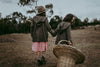The sisters Iris & Nina are photographed wearing the Woollen overcoat in branch over there dresses.  This is an easy dress to wear every day and machine washable. Made in Australia. Available in sizes from 1-2 years up to 12 yrs.